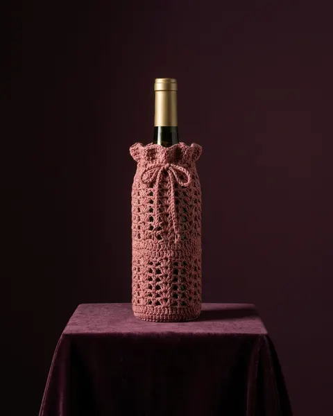 Capa de crochê rosé para garrafa de vinho